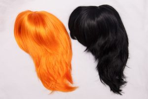 orange wig and black wig