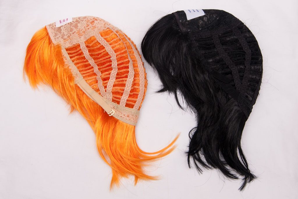 orange wig and black wig