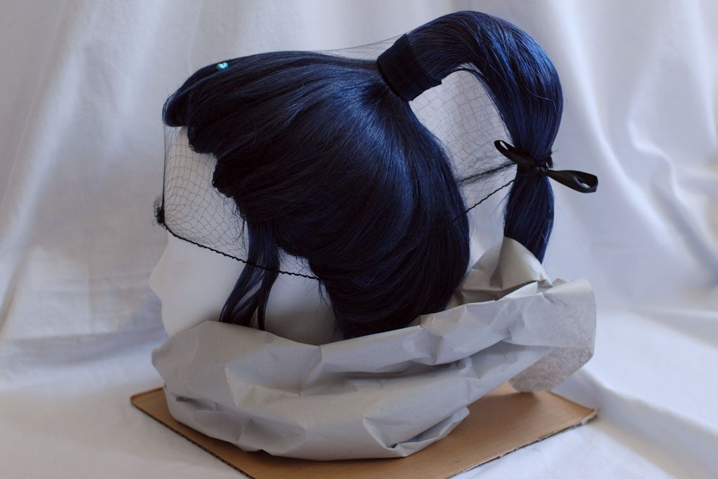 wig with protruding ponytail