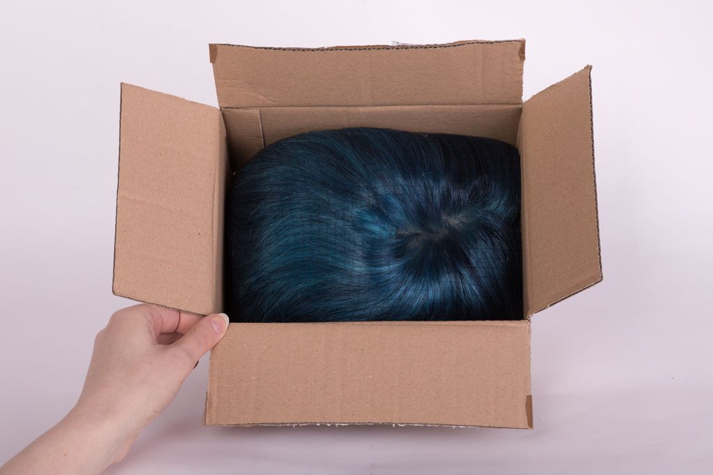 wig face down in box