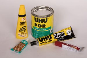 containers with different types of glue