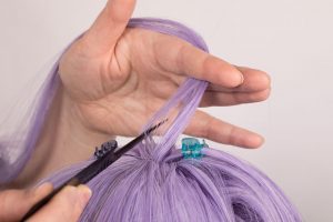 wig parted with tail comb